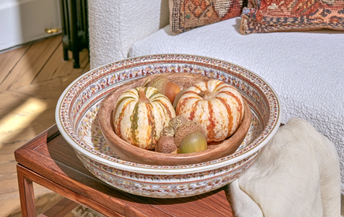 fall table centerpieces featuring mini pumpkins in nested decorative bowls on a wooden table