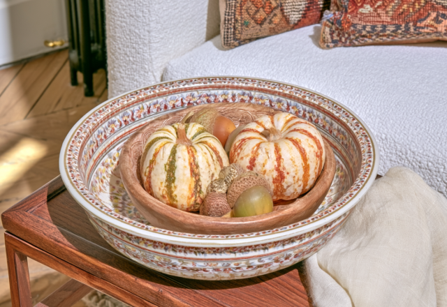 fall table centerpieces featuring mini pumpkins in nested decorative bowls on a wooden table