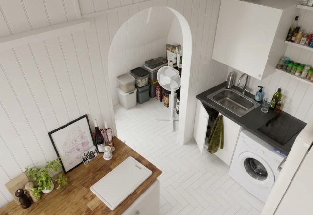 Bright small kitchen layout featuring vertical wall paneling and an under-stair pantry.