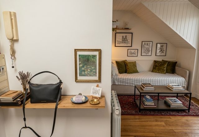 Small studio apartment organization featuring a floating entryway shelf and cozy attic living space