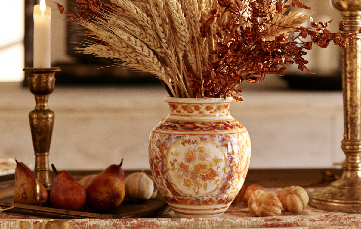 Autumn table centerpiece featuring dried wheat, heirloom pears, and a hand-painted ceramic vase.