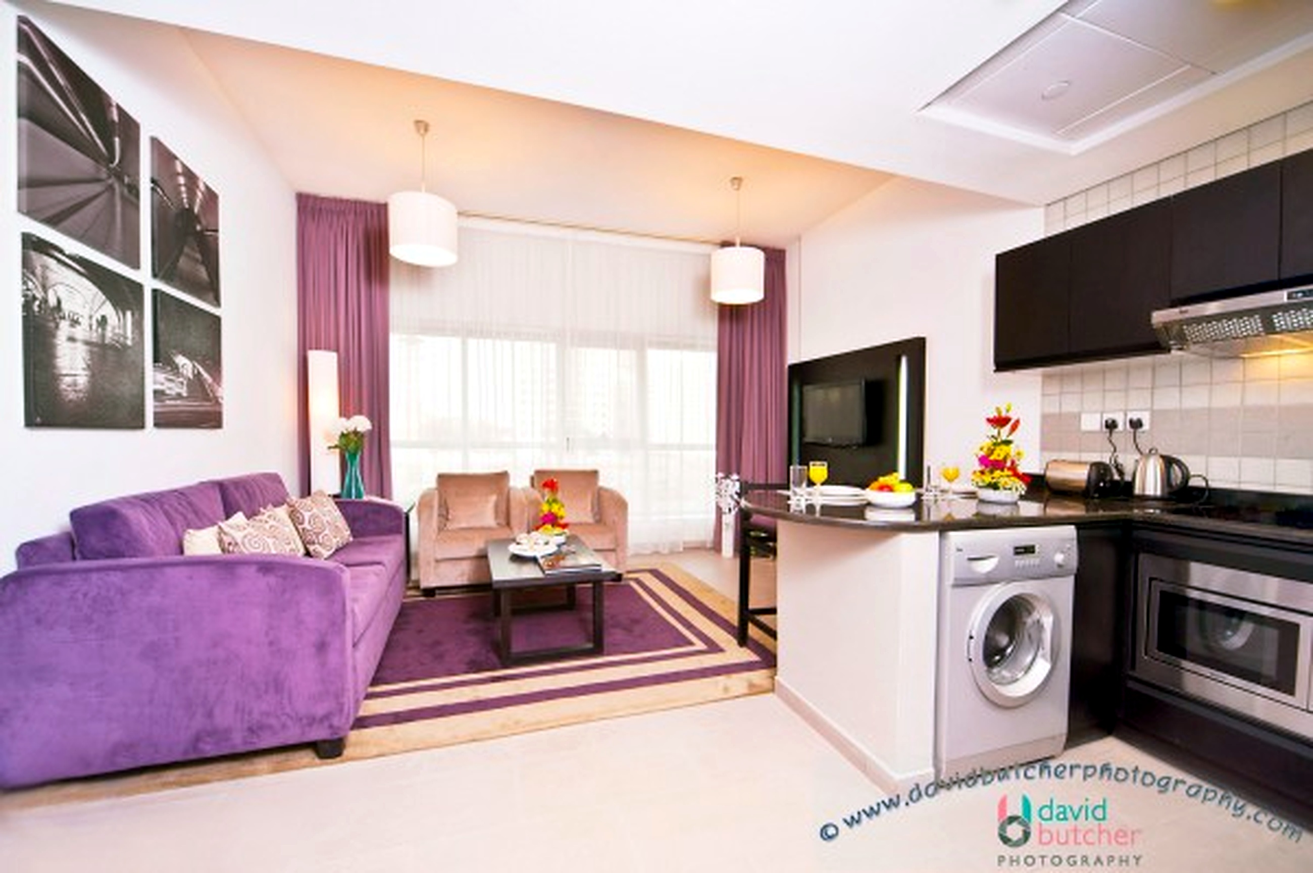 Comfortable Auris Metro Central Hotel Apartments and The Wonderful Purple Interior Designs: Luxury Deluxe Bedroom With Cream Big Headbed And Modern Bedding For Director Suite In Auris Metro Hotel