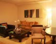 Amazing Lebua at State Tower Hotel and Club Interior Design and Facilities: brown minimalist guest living room design with two soffas and two table in lebua at state tower
