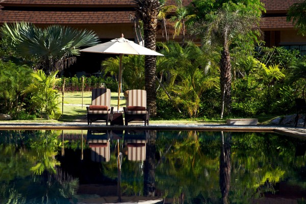 : Beautiul Sunbathing Area With The Best Relaxing Chair And The Umbrella