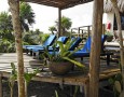 Beautiful Sunbathing Area Decoration in the Backyard with the Best Furniture: Classic-sunbathing-area-with-blue-relaxing-chair