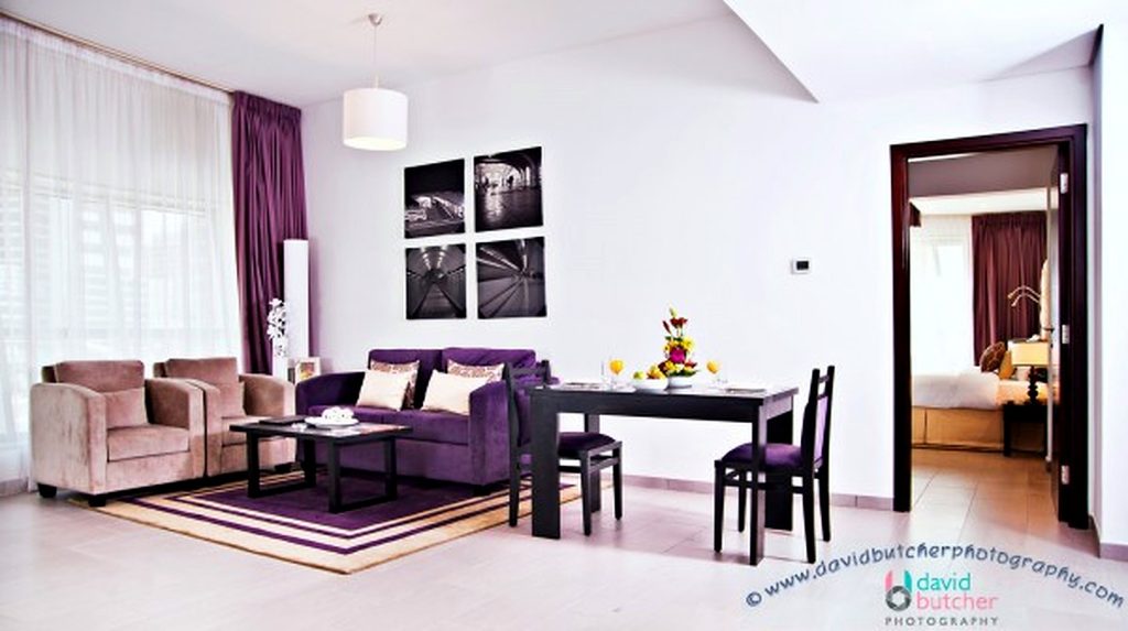 Sweet Auris Metro Family Suite With A Dining Table For 2 And Cream And Purple Sofa 600x336 1