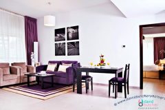 Sweet Auris Metro Family Suite With A Dining Table For 2 And Cream And Purple Sofa 600x336 1 Scaled