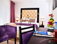Comfortable Auris Metro Central Hotel Apartments and The Wonderful Purple Interior Designs: Wonderful Director Suite Master Bedroom with purple and white theme in auris methor hotel