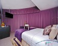 Comfortable Auris Metro Central Hotel Apartments and The Wonderful Purple Interior Designs: beautiful Purple curtain decoration and hanging tv cable facilities for President Suite in auris metro hotel
