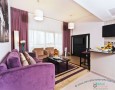 Comfortable Auris Metro Central Hotel Apartments and The Wonderful Purple Interior Designs: two elegant hanging lamp for auris metro suite hotel with the best fresh flower decoration