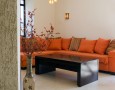 Couches for Small Living Rooms for Modern and Minimalist Spaces: orange couches for small living rooms with flowery pottery barn and decorative plant