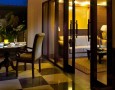Exotic Khayangan Dreams Villa Seminyak Bali Indonesia with Tropical Nuance: contemporary dining room tables near living room with glass wall partition