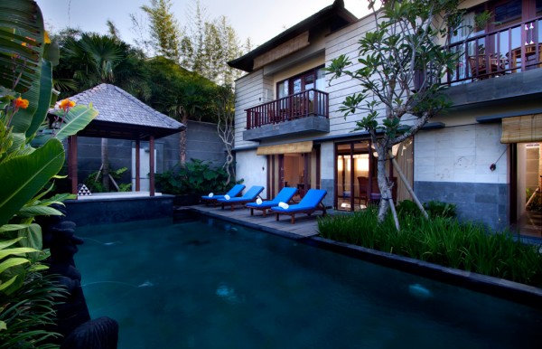 large private swimming pool with waterfall stone sculptur for two bedroom suite in khayangan villa