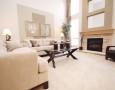 How to Set Up and Arrange A Living Room: how to set up living room with a modern fireplace and L couch arrangement