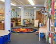Playgroup room designs for brainy child: Imaginative playgroup room design with round carpet