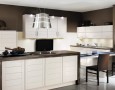 Kitchen Design for Small Home with Modern and Minimalist Style: good planning of a small kitchen combined with dining table for 2 and completed with tv