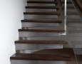 Modern Staircase Designs for Homes: attaching wooden stair treads on concrete wall