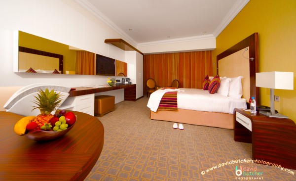 Stylish Auris Plaza Hotel with The Modern Interior Design Gallery: Amazing bedroom decorating idea with wooden furniture and modern box pattern rug 600×366 1