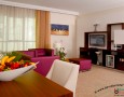Stylish Auris Plaza Hotel with The Modern Interior Design Gallery: Auris Plaza Hotel facilities and the wooden tv cabinet and litle refrigerator