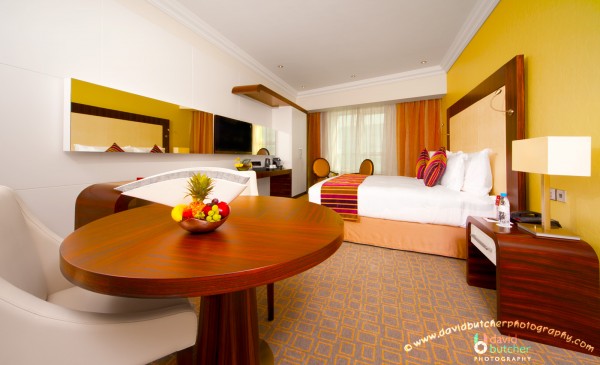 : Contemporary Bedroom Design For Hotel With Master Bed Litle Dining Table And Make Up Table Also Cabinet