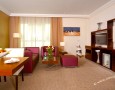 Stylish Auris Plaza Hotel with The Modern Interior Design Gallery: Purple cream living room with dining table decorated with beautiful modern pottery barn