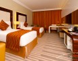 Stylish Auris Plaza Hotel with The Modern Interior Design Gallery: The comfortable deluxe room with brown curtain decoration idea