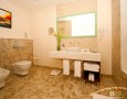 Stylish Auris Plaza Hotel with The Modern Interior Design Gallery: classic bathroom with white sink and tile decoration for classic room in Auris Plaza Hotel