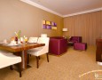 Stylish Auris Plaza Hotel with The Modern Interior Design Gallery: white brown dining room with wooden table and purple soffa and unique pottery barn